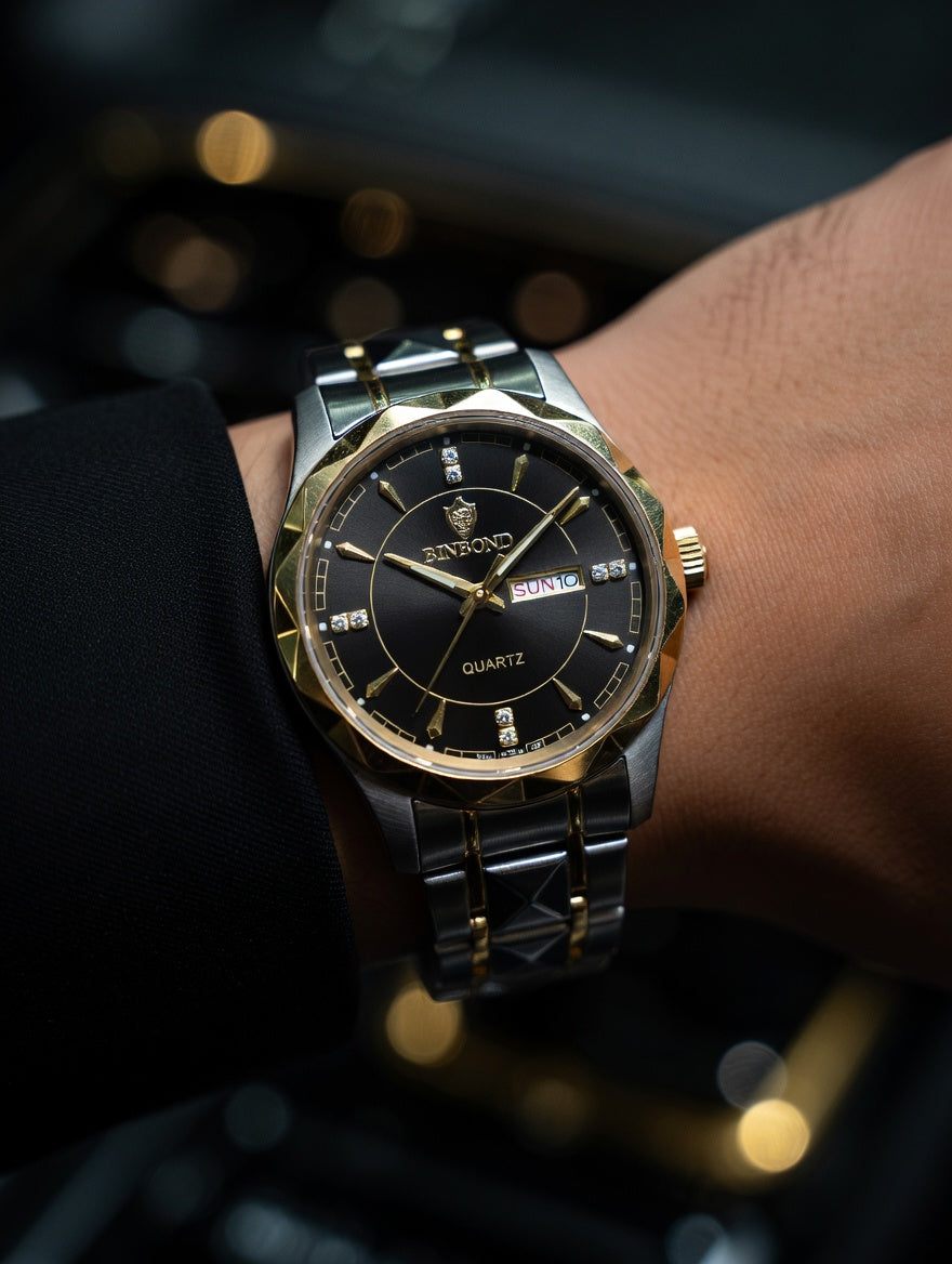 Gold and silver watch on a wrist with a blurred background