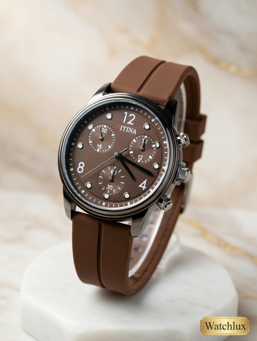 Brown dial mens leather strap chronograph watch by Watchlux on white marble surface